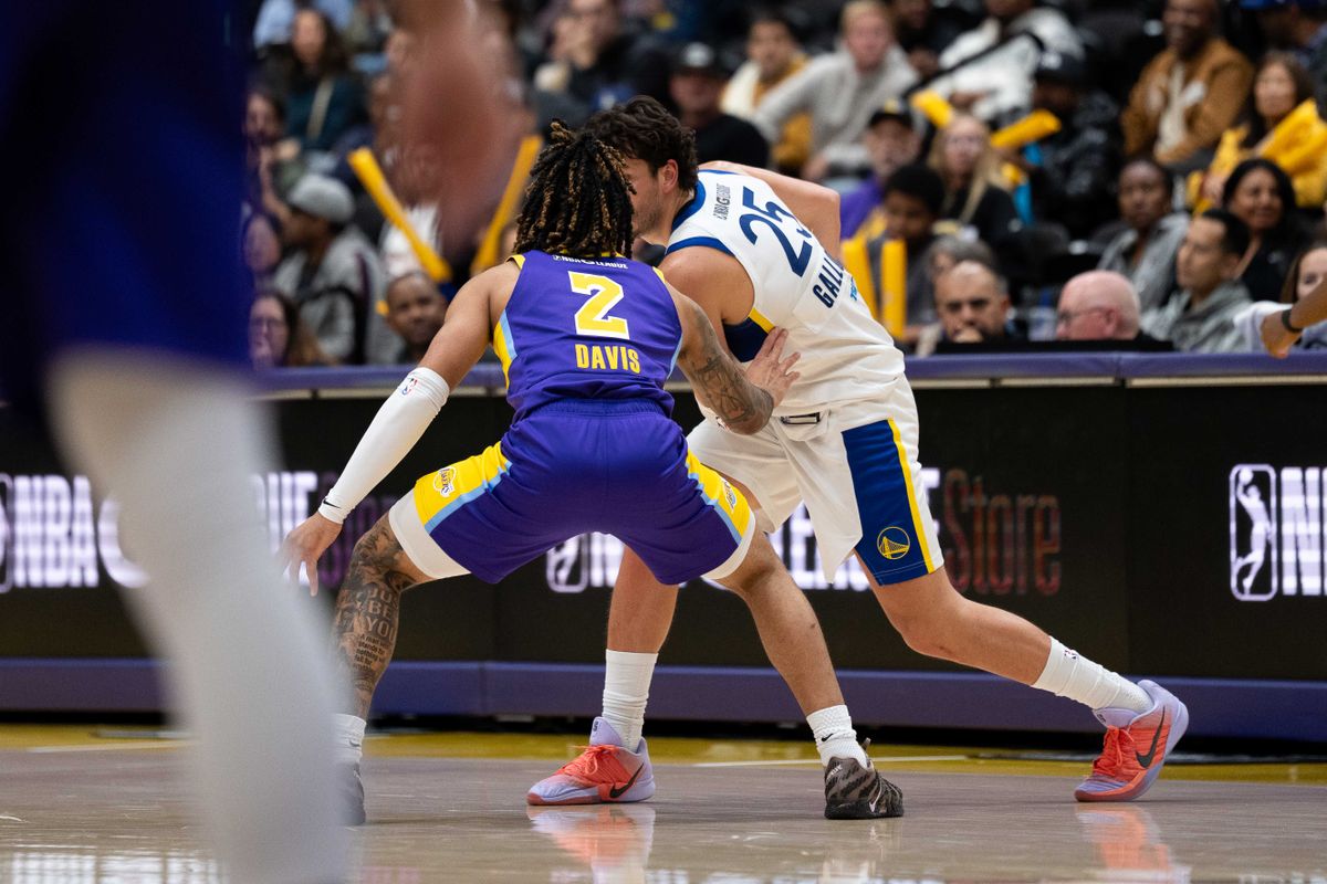 South Bay Lakers guard RJ Davis (2) defends a player during an NBA G League basketball game against the Santa Cruz Warriors on Friday, Nov. 21, 2025, in El Segundo, Calif. South Bay Lakers guard RJ Davis (2) defends a player during an NBA G League basketball game against the Santa Cruz Warriors on Friday, Nov. 21, 2025, in El Segundo, Calif.