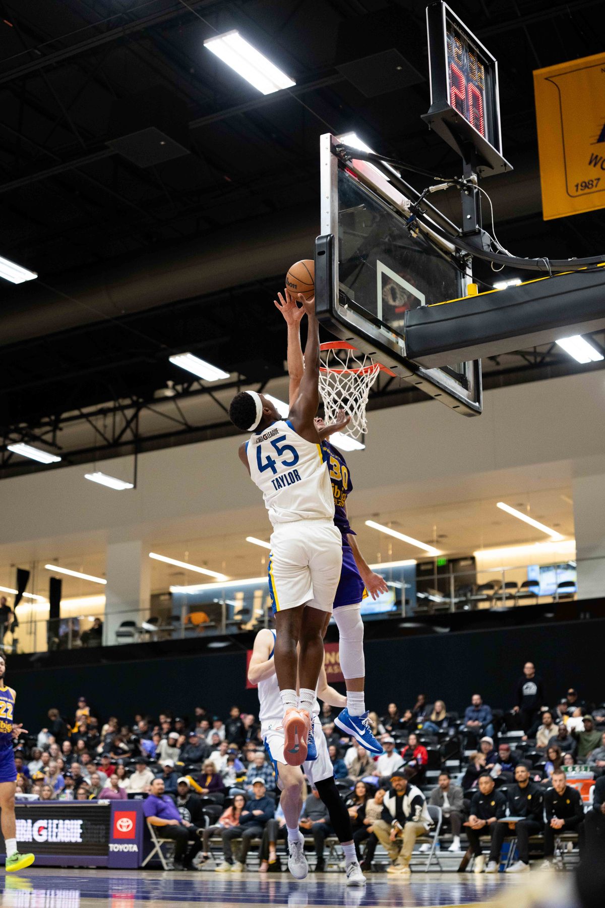 South Bay Lakers guard Chris Mañon (30) blocks a shot during an NBA G League basketball game against the Santa Cruz Warriors on Friday, Nov. 21, 2025, in El Segundo, Calif. South Bay Lakers guard Chris Mañon (30) blocks a shot during an NBA G League basketball game against the Santa Cruz Warriors on Friday, Nov. 21, 2025, in El Segundo, Calif.