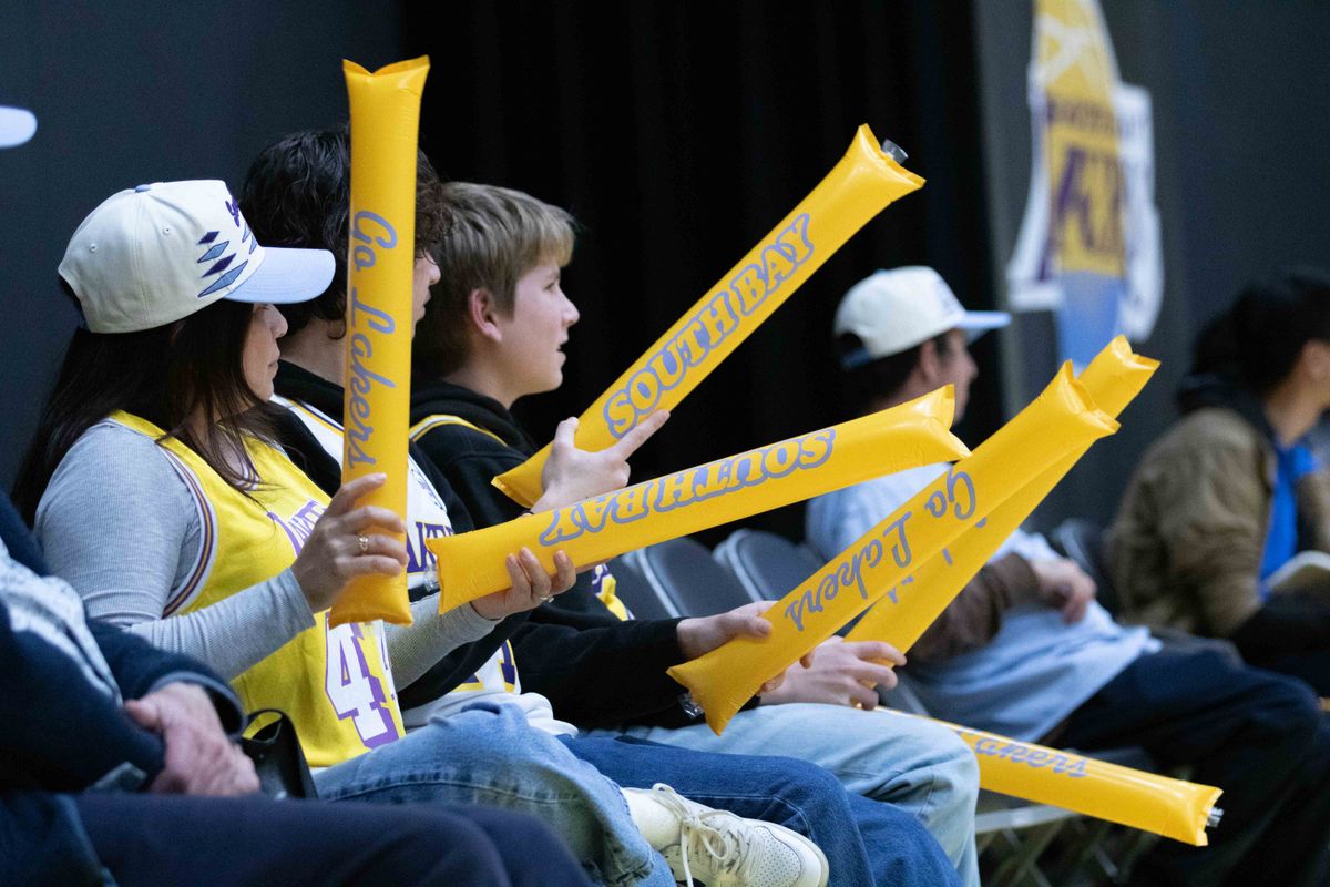 Fans cheer with thunder sticks during a G-League basketball game between the South Bay Lakers and Memphis Hustle Tuesday, January 6, 2026 at UCLA Health Training Center in El Segendo, Calif. Fans cheer with thunder sticks during a G-League basketball game between the South Bay Lakers and Memphis Hustle Tuesday, January 6, 2026 at UCLA Health Training Center in El Segendo, Calif.
