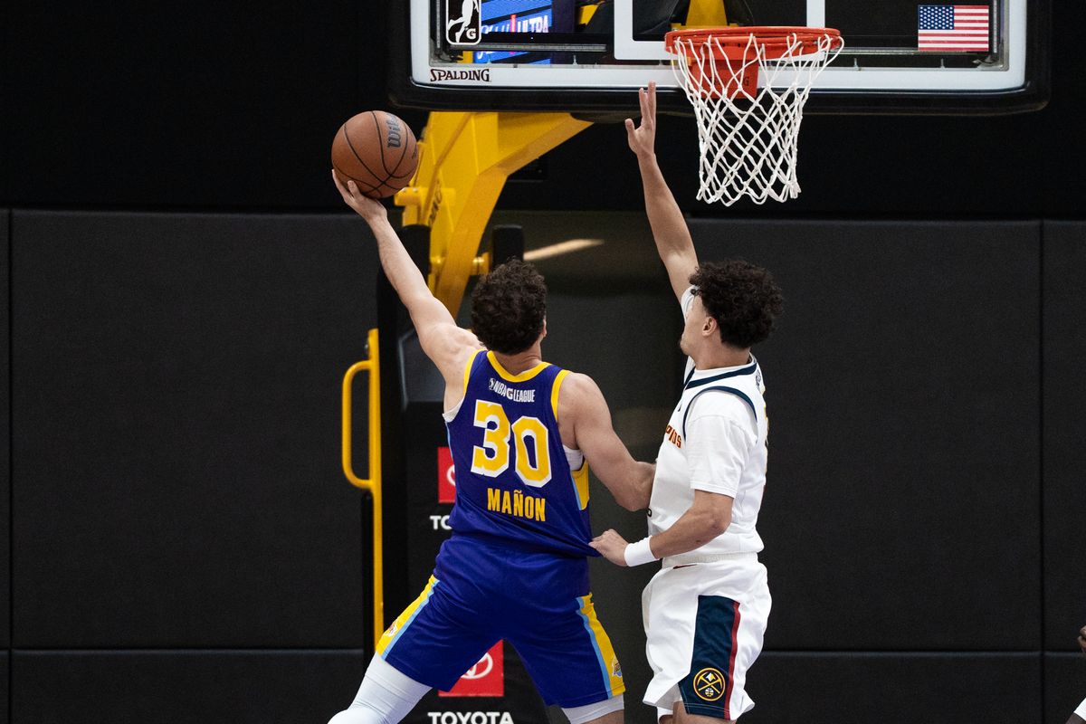 South Bay Lakers guard Chris Manon (30) goes up on his defender and finishes a tough layup during an NBA G-League basketball game against the Grand Rapids Gold, Saturday March 21st, 2026 in El Segundo California South Bay Lakers guard Chris Manon (30) goes up on his defender and finishes a tough layup during an NBA G-League basketball game against the Grand Rapids Gold, Saturday March 21st, 2026 in El Segundo California
