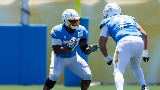 Zion Johnson #77 of the Los Angeles Chargers blocks during training camp at The Bolt on July 24, 2025 in El Segundo, California. Zion Johnson #77 of the Los Angeles Chargers blocks during training camp at The Bolt on July 24, 2025 in El Segundo, California.