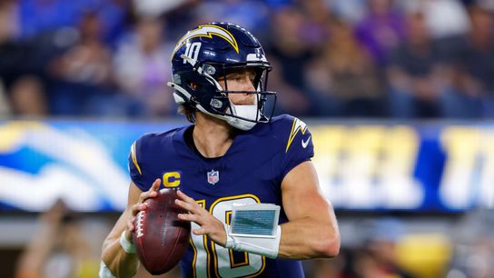Justin Herbert (10) of the Los Angeles Chargers drops back to ball. Justin Herbert (10) of the Los Angeles Chargers drops back to ball.