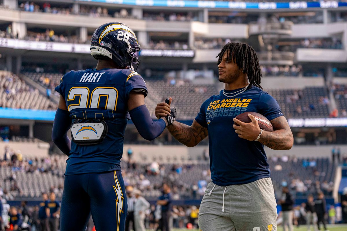 Los Angeles Chargers running back, Omarion Hampton (8) with teammate Cam Hart (20) before an NFL football game against the Las Vegas Raiders on November 30, 2025 in Los Angeles, CA. Los Angeles Chargers running back, Omarion Hampton (8) with teammate Cam Hart (20) before an NFL football game against the Las Vegas Raiders on November 30, 2025 in Los Angeles, CA.