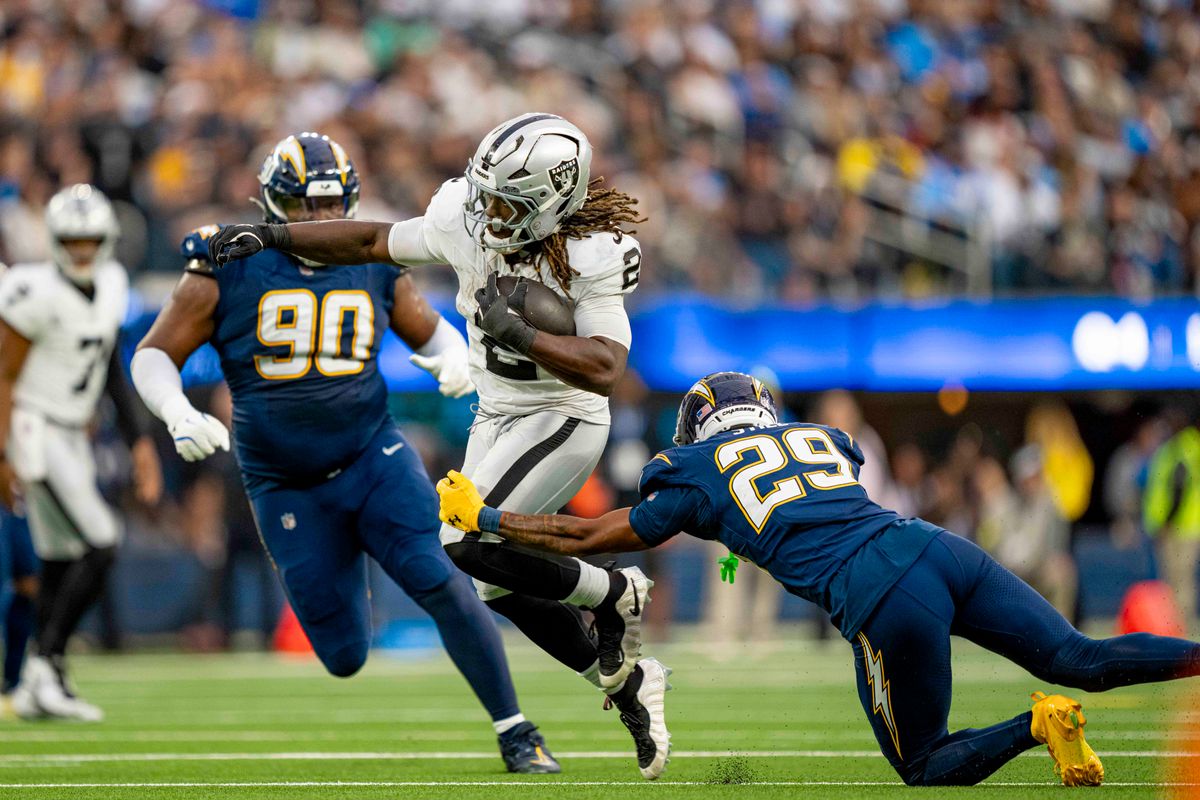 Las Vegas Raiders running back, Ashton Jeanty (2) breaks a tackle during an NFL football game against the Los Angeles Chargers on November 30, 2025 in Los Angeles, CA. Las Vegas Raiders running back, Ashton Jeanty (2) breaks a tackle during an NFL football game against the Los Angeles Chargers on November 30, 2025 in Los Angeles, CA.