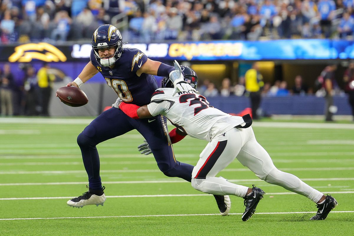 Los Angeles Chargers quarterback Justin Herbert (10) runs the ball for a gain during a NFL game against the Houston Texans on December 027, 2025 at Sofi Stadium in Inglewood, CA. Los Angeles Chargers quarterback Justin Herbert (10) runs the ball for a gain during a NFL game against the Houston Texans on December 027, 2025 at Sofi Stadium in Inglewood, CA.