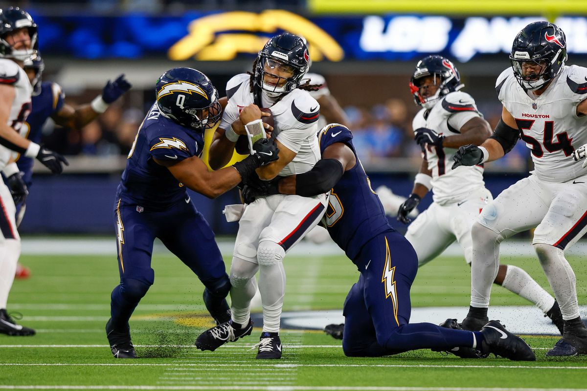 Houston Texans quarterback C.J. Stroud (7) gets sacked by Los Angeles Chargers linebacker Daiyan Henley (0) and Los Angeles Chargers linebacker Odafe Oweh (98) during a NFL game against the Houston Texans on December 027, 2025 at Sofi Stadium in Inglewood, CA. Houston Texans quarterback C.J. Stroud (7) gets sacked by Los Angeles Chargers linebacker Daiyan Henley (0) and Los Angeles Chargers linebacker Odafe Oweh (98) during a NFL game against the Houston Texans on December 027, 2025 at Sofi Stadium in Inglewood, CA.