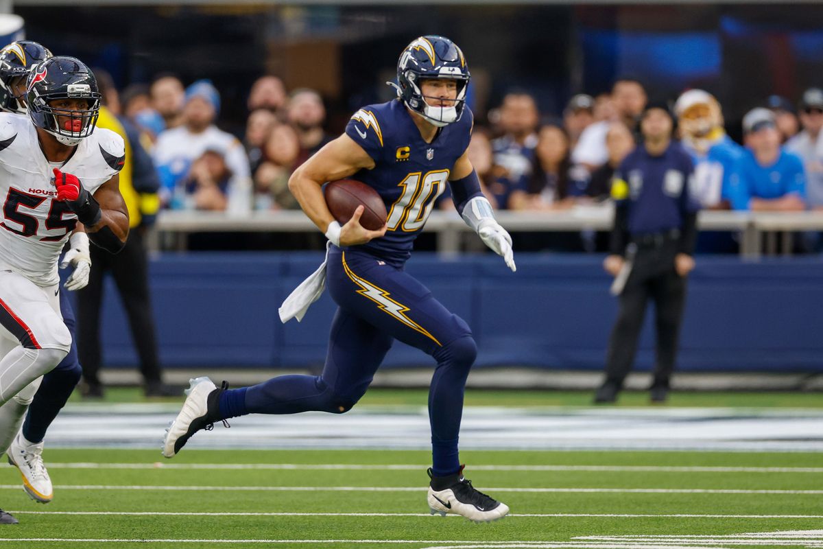 Los Angeles Chargers quarterback Justin Herbert (10) runs the ball for a gain during a NFL game against the Houston Texans on December 027, 2025 at Sofi Stadium in Inglewood, CA. Los Angeles Chargers quarterback Justin Herbert (10) runs the ball for a gain during a NFL game against the Houston Texans on December 027, 2025 at Sofi Stadium in Inglewood, CA.