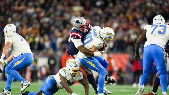 Jan 11, 2026; Foxborough, MA, USA; Los Angeles Chargers quarterback Justin Herbert (10) is sacked by New England Patriots linebacker Anfernee Jennings (33) during the fourth quarter against the New England Patriotsin an AFC Wild Card Round game at Gillette Stadium. Jan 11, 2026; Foxborough, MA, USA; Los Angeles Chargers quarterback Justin Herbert (10) is sacked by New England Patriots linebacker Anfernee Jennings (33) during the fourth quarter against the New England Patriotsin an AFC Wild Card Round game at Gillette Stadium.