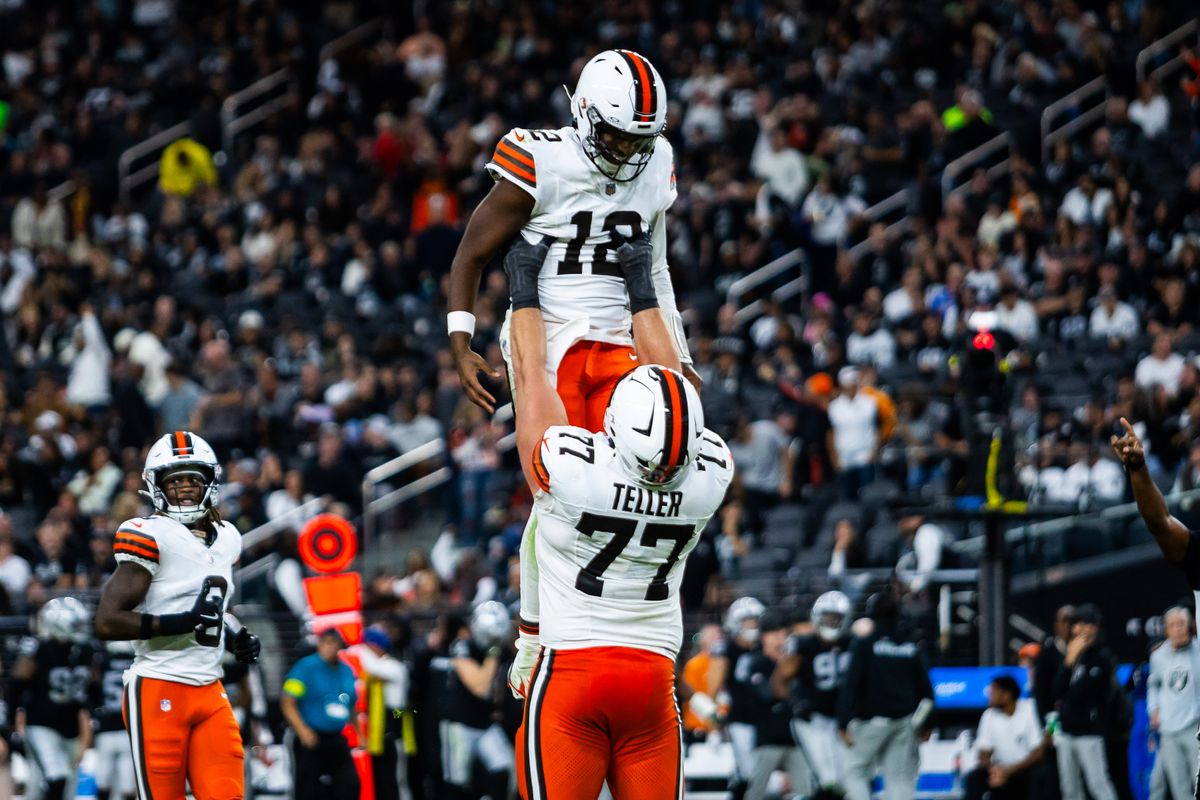 Cleveland Browns guard Wyatt Teller (77) carries quarterback Shadeur Sanders (12) after Sanders throws for his first touchdown during a NFL game between the Las Vegas Raiders and the Cleveland Browns, Sunday November 23, 2025 in Las Vegas, Nev. Cleveland Browns guard Wyatt Teller (77) carries quarterback Shadeur Sanders (12) after Sanders throws for his first touchdown during a NFL game between the Las Vegas Raiders and the Cleveland Browns, Sunday November 23, 2025 in Las Vegas, Nev.