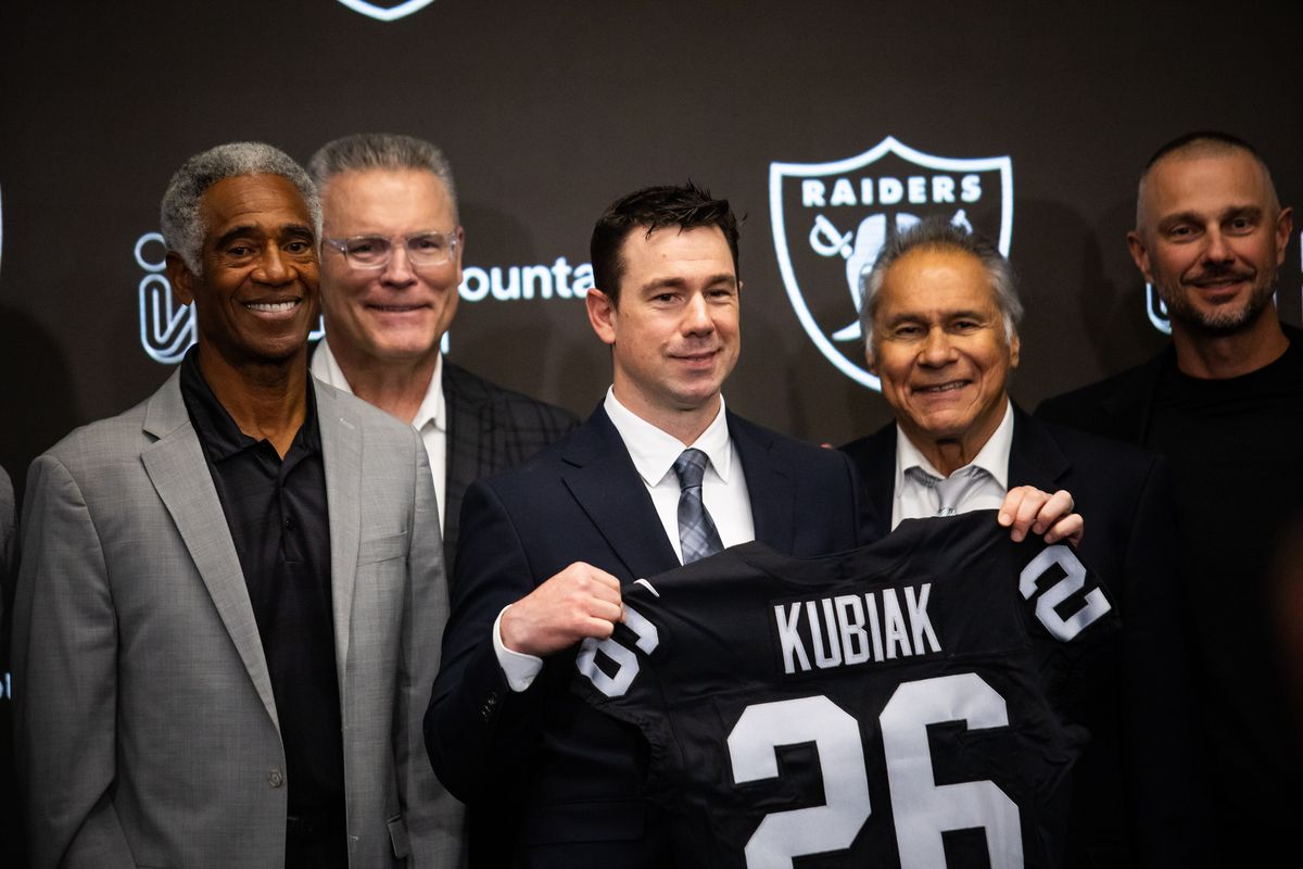 Las Vegas Raiders newly hired head coach Klint Kubiak holds a Raiders jersey and poses for a photo after a press conference, Tuesday February 10, 2026 in Henderson, Nev. Las Vegas Raiders newly hired head coach Klint Kubiak holds a Raiders jersey and poses for a photo after a press conference, Tuesday February 10, 2026 in Henderson, Nev.