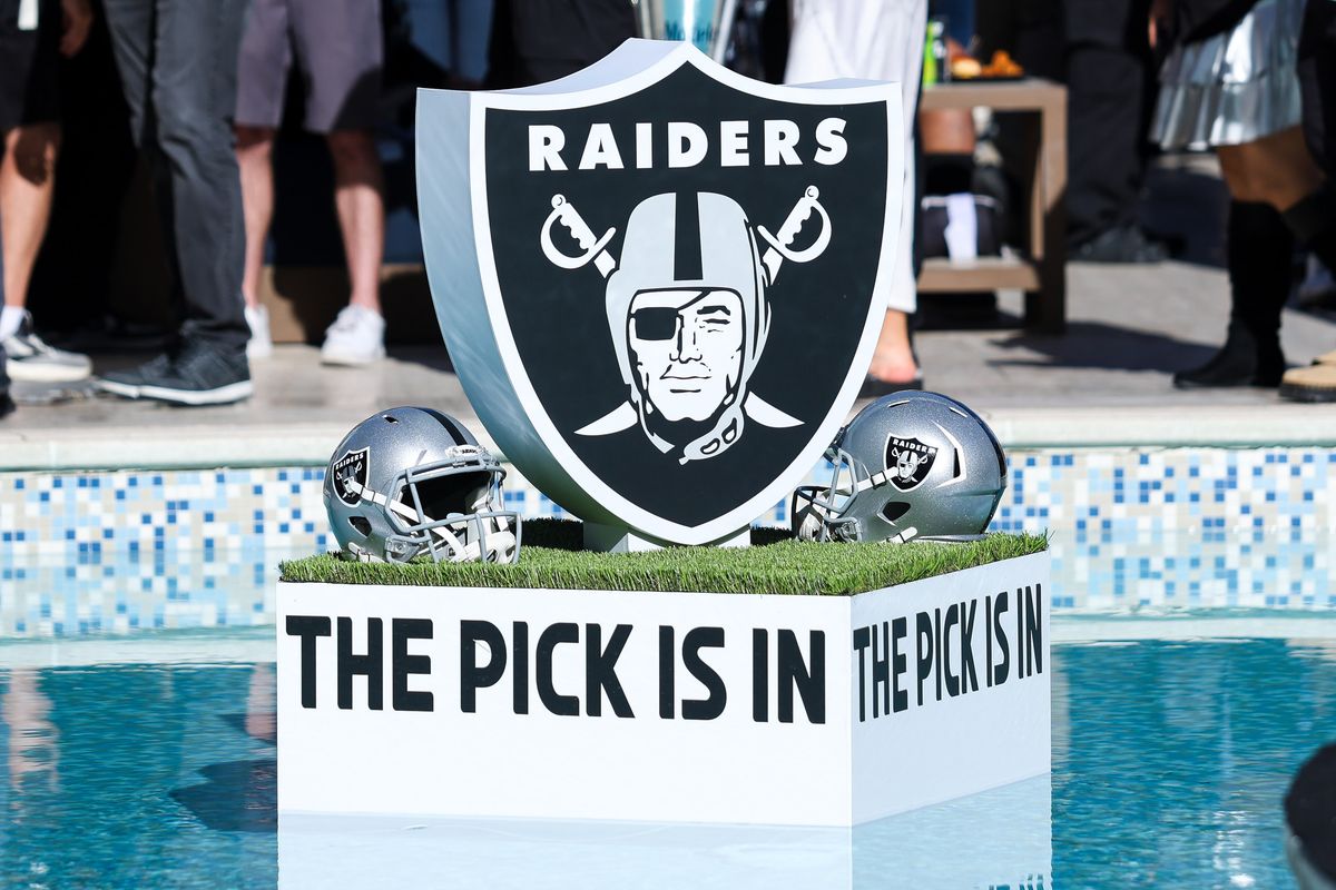 Las Vegas Raiders logo and helmets displayed at the Palms pool during the Raiders 2026 Draft Party, Thursday April 23, 2026 in Las Vegas, Nev. Las Vegas Raiders logo and helmets displayed at the Palms pool during the Raiders 2026 Draft Party, Thursday April 23, 2026 in Las Vegas, Nev.