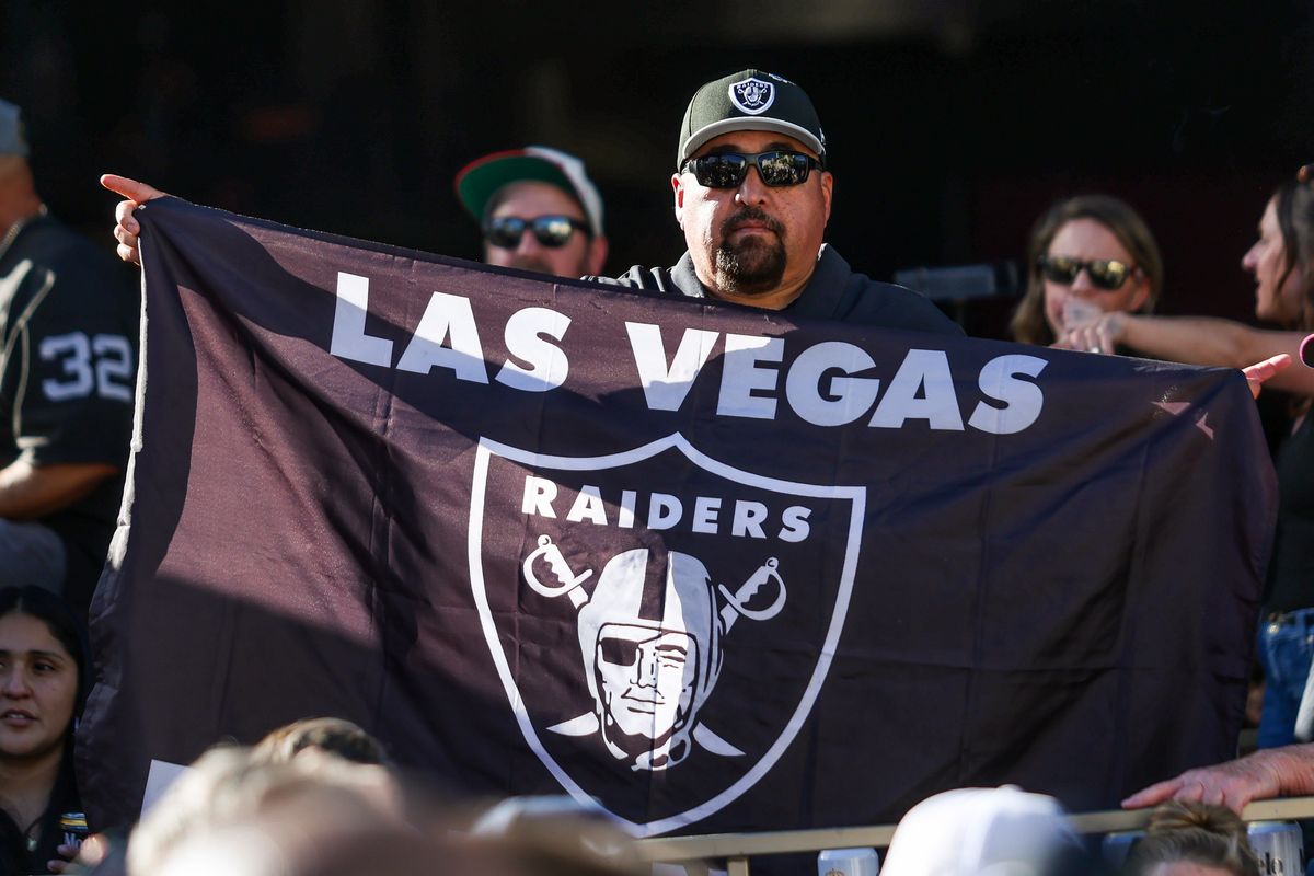 Fan holds up a Las Vegas Raiders flag at the Raiders 2026 Draft Party at Palms Casino Resort, Thursday April 23, 2026 in Las Vegas, Nev. Fan holds up a Las Vegas Raiders flag at the Raiders 2026 Draft Party at Palms Casino Resort, Thursday April 23, 2026 in Las Vegas, Nev.