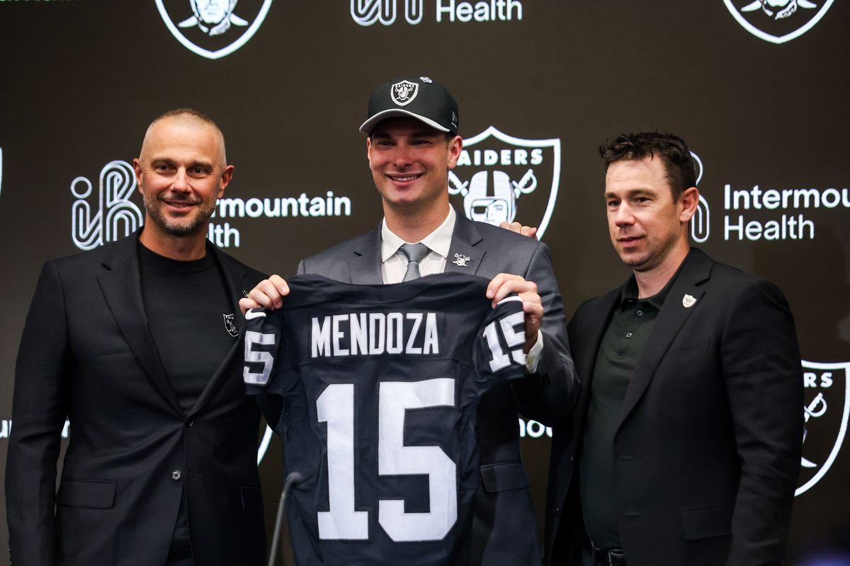 Las Vegas Raiders general manager John Spytek, quarterback Fernando Mendoza, and head coach Klint Kubiak pose for a photo after a press conference, Friday April 24, 2026 in Henderson, Nev. Las Vegas Raiders general manager John Spytek, quarterback Fernando Mendoza, and head coach Klint Kubiak pose for a photo after a press conference, Friday April 24, 2026 in Henderson, Nev.