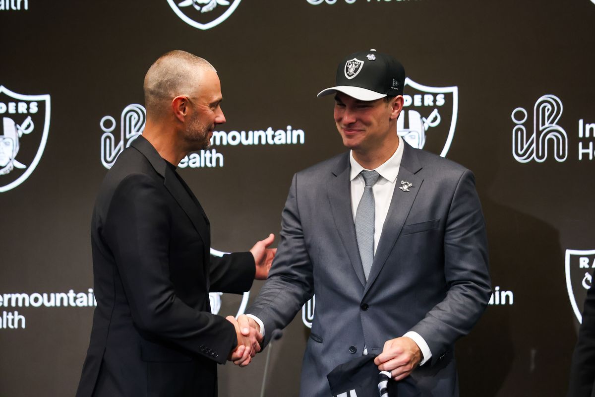 Las Vegas Raiders general manager John Spytek shakes the hand of quarterback Fernando Mendoza after a press conference, Friday April 24, 2026 in Henderson, Nev. Las Vegas Raiders general manager John Spytek shakes the hand of quarterback Fernando Mendoza after a press conference, Friday April 24, 2026 in Henderson, Nev.
