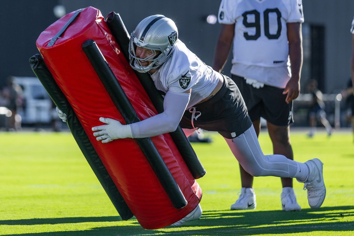 Las Vegas Raiders defensive end Maxx Crosby (98) tackles a pad in a defensive line drill during Raiders Training Camp at Intermountain Health Performance Center, Friday July 31, 2026 in Henderson, Nev. Las Vegas Raiders defensive end Maxx Crosby (98) tackles a pad in a defensive line drill during Raiders Training Camp at Intermountain Health Performance Center, Friday July 31, 2026 in Henderson, Nev.