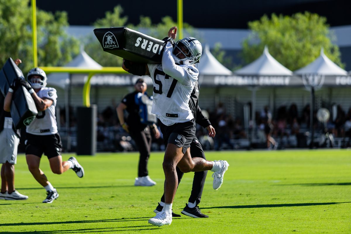 Las Vegas Raiders linebacker Cameron McGrone (57) lifts a tackling pad during Raiders Training Camp at Intermountain Health Performance Center, Friday July 31, 2026 in Henderson, Nev. Las Vegas Raiders linebacker Cameron McGrone (57) lifts a tackling pad during Raiders Training Camp at Intermountain Health Performance Center, Friday July 31, 2026 in Henderson, Nev.