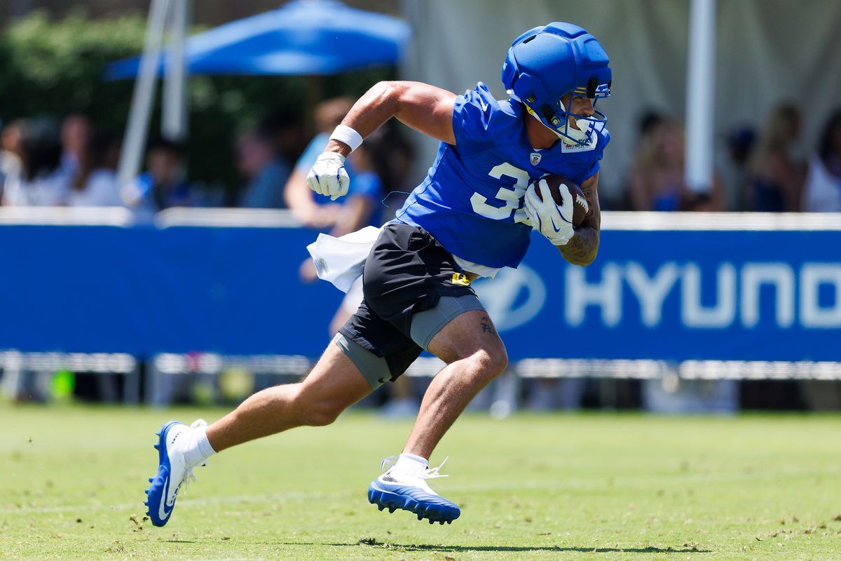 Dean Connors #33 of the Los Angeles Rams runs with the ball during training camp at Loyola Marymount University on July 29, 2026 in Los Angeles, California. Dean Connors #33 of the Los Angeles Rams runs with the ball during training camp at Loyola Marymount University on July 29, 2026 in Los Angeles, California.
