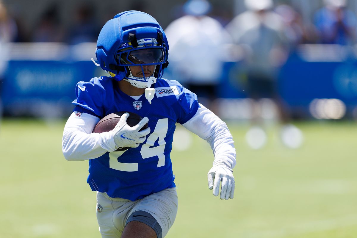 Blake Corum #22 of the Los Angeles Rams runs with the ball during training camp at Loyola Marymount University on July 29, 2026 in Los Angeles, California. Blake Corum #22 of the Los Angeles Rams runs with the ball during training camp at Loyola Marymount University on July 29, 2026 in Los Angeles, California.