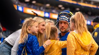 Matthew Stafford’s neon family shines for the Los Angeles Rams playoff win taken at Soldier Field (Los Angeles Rams). Photo by Jessica Cryderman - The Sporting Tribune