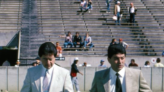 San Francisco 49ers owner Eddie DeBartolo Jr. (right) and general manager Carmen Policy (left) on the filed prior to a game against the Tampa Bay Buccaneers at Tampa Stadium