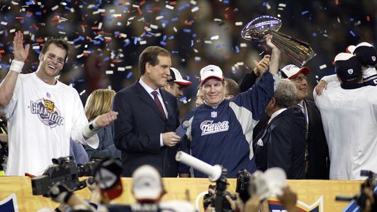 New England Patriots head coach Bill Belichick celebrates with the Vince Lombardi Trophy after defeating the Carolina Panthers during Super Bowl XXXVIII at Reliant Stadium. The Patriots defeated the Panthers 32-29. 
