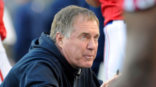 New England Patriots head coach Bill Belichick talks to his defense during the second quarter against the New York Jets at Gillette Stadium.