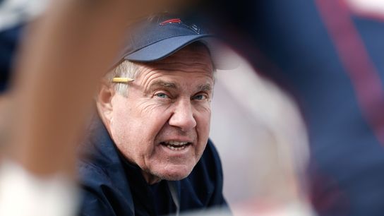  New England Patriots head coach Bill Belichick talks with his defense during the first quarter against the Miami Dolphins at Gillette Stadium.