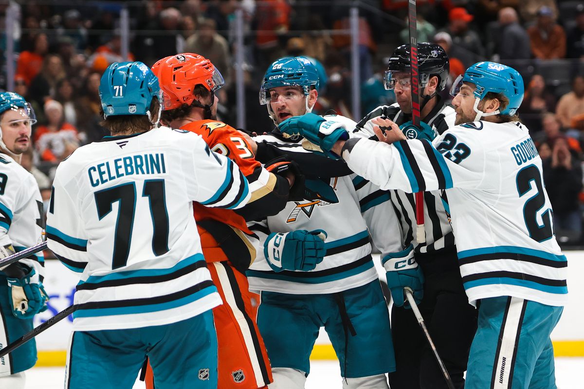Teammates and officials attempt to break up a fight during an NHL game between the Anaheim Ducks and the San Jose Sharks on December 29, 2025 in Anaheim, CA. Teammates and officials attempt to break up a fight during an NHL game between the Anaheim Ducks and the San Jose Sharks on December 29, 2025 in Anaheim, CA.