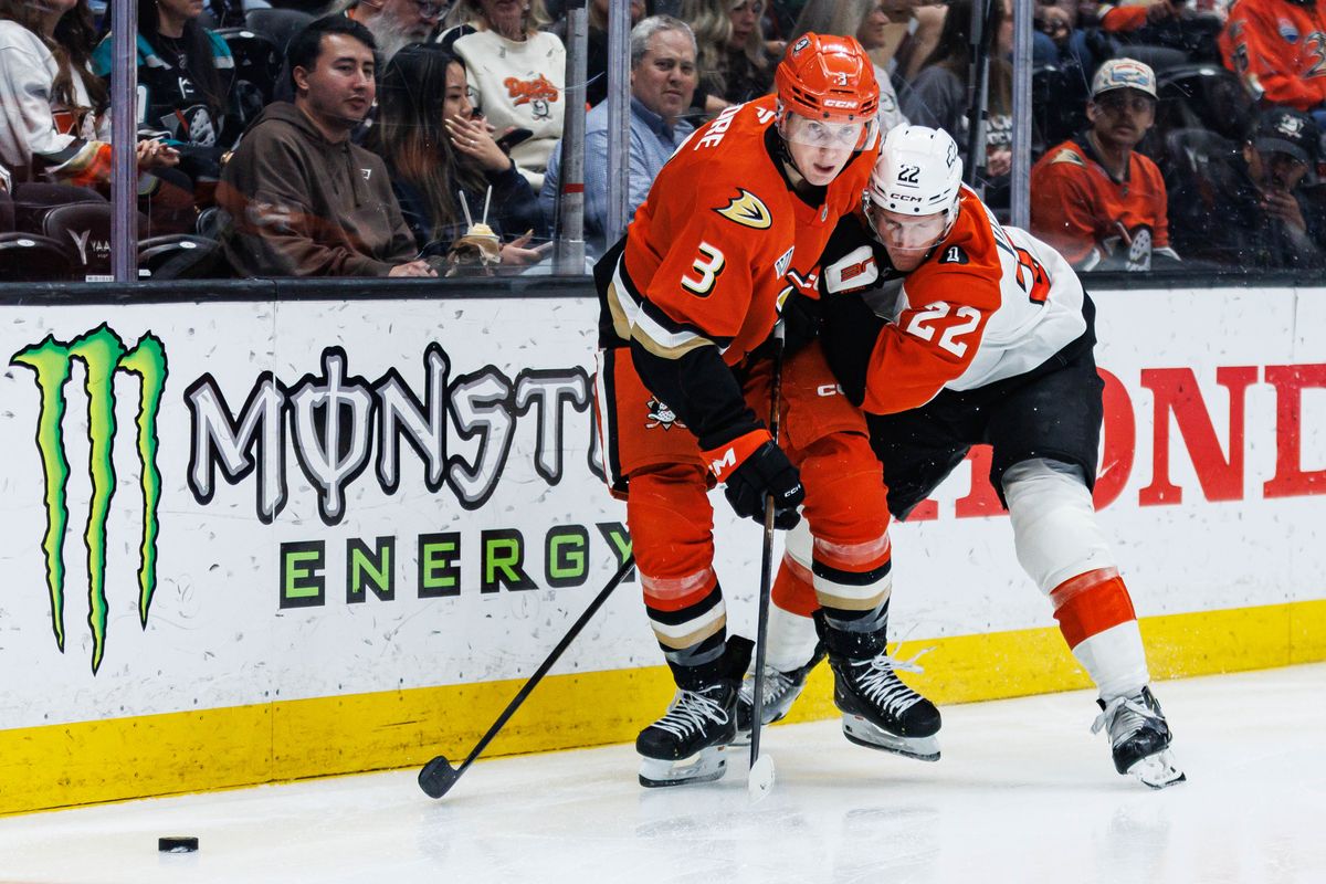 Anaheim Ducks defenseman Ian Moore (#3) battles for possession of the puck during an NHL match against the Philadelphia Flyers on March 18, 2026 in Anaheim, California. Anaheim Ducks defenseman Ian Moore (#3) battles for possession of the puck during an NHL match against the Philadelphia Flyers on March 18, 2026 in Anaheim, California.