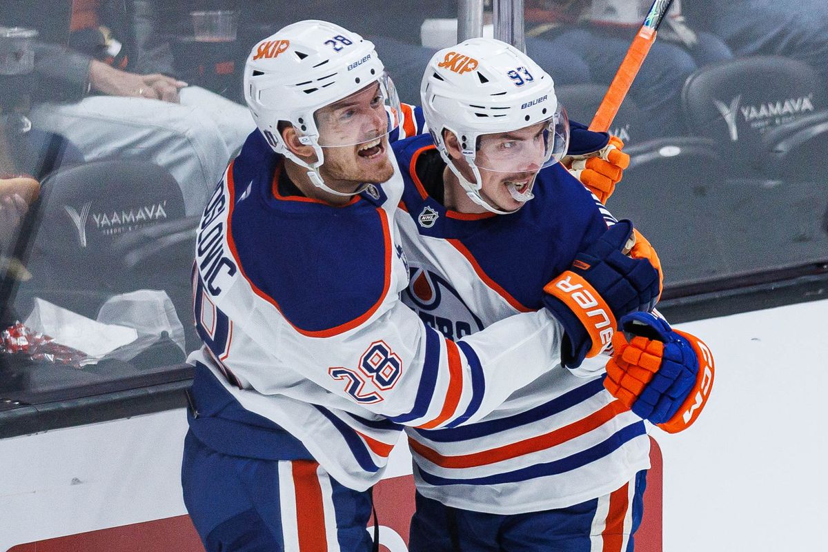 Ryan Nugent-Hopkins #93 (right) of the Edmonton Oilers celebrates with Jack Roslovic #28 (left) after scoring a goal during an NHL Playoffs game against the Anaheim Ducks on April 24, 2026 at Honda Center in Anaheim, California. Ryan Nugent-Hopkins #93 (right) of the Edmonton Oilers celebrates with Jack Roslovic #28 (left) after scoring a goal during an NHL Playoffs game against the Anaheim Ducks on April 24, 2026 at Honda Center in Anaheim, California.