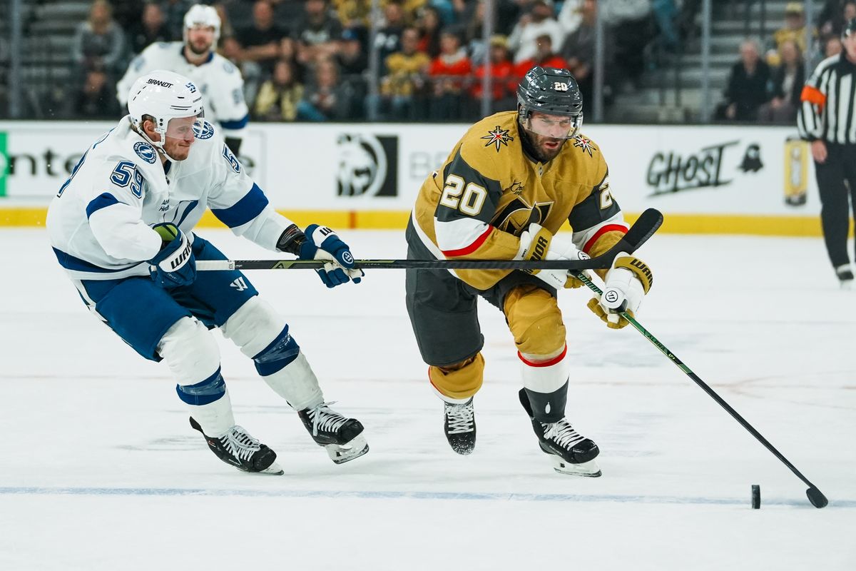 Vegas Golden Knights left wing Brandon Saad (20) and Tampa Bay Lightning center Jake Guentzel (59) race to the puck during first period of NHL game against Tampa Bay Lightning on Tuesday, Nov. 6, 2025 at T-Mobile Arena in Las Vegas. Vegas Golden Knights left wing Brandon Saad (20) and Tampa Bay Lightning center Jake Guentzel (59) race to the puck during first period of NHL game against Tampa Bay Lightning on Tuesday, Nov. 6, 2025 at T-Mobile Arena in Las Vegas.