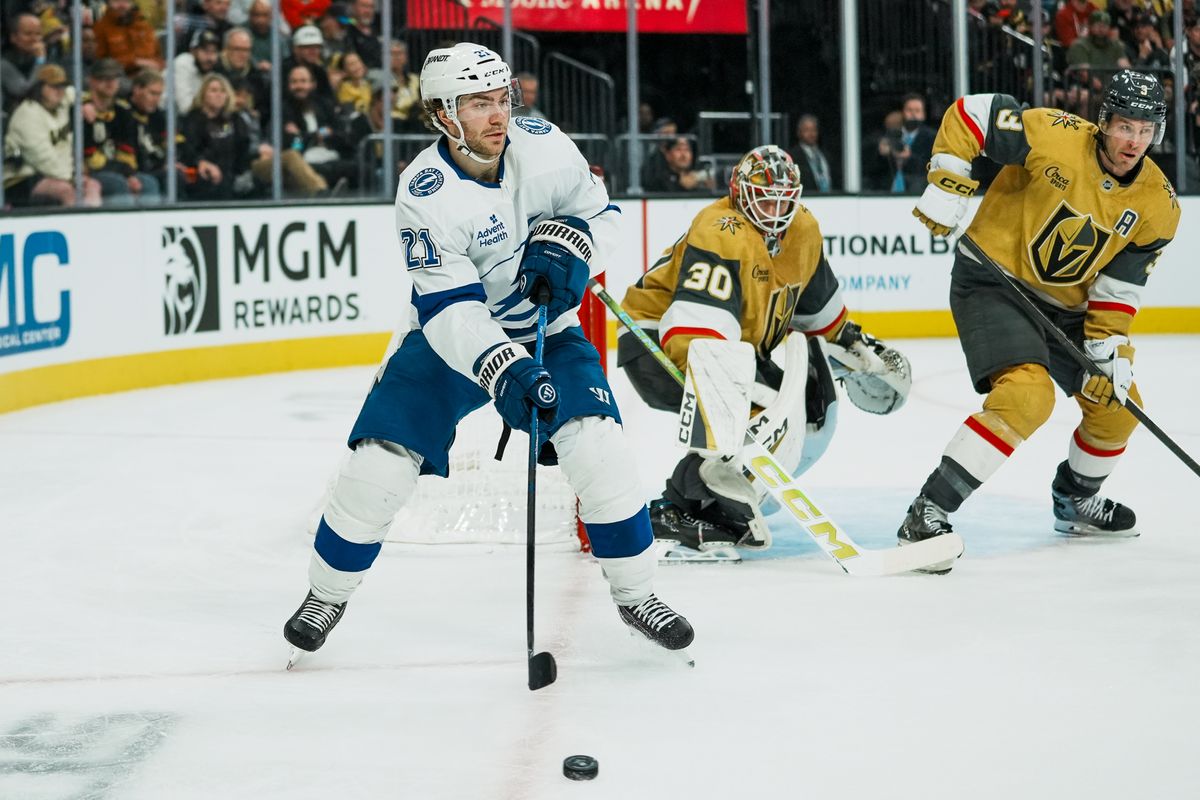 Tampa Bay Lightning center Brayden Point (21) passes the puck while Vegas Golden Knights defenseman Brayden McNabb and goalie Carl Windburn (30) defend the goal during second period of NHL game against Vegas Golden Knights on Tuesday, Nov. 6, 2025 at T-Mobile Arena in Las Vegas. Tampa Bay Lightning center Brayden Point (21) passes the puck while Vegas Golden Knights defenseman Brayden McNabb and goalie Carl Windburn (30) defend the goal during second period of NHL game against Vegas Golden Knights on Tuesday, Nov. 6, 2025 at T-Mobile Arena in Las Vegas.