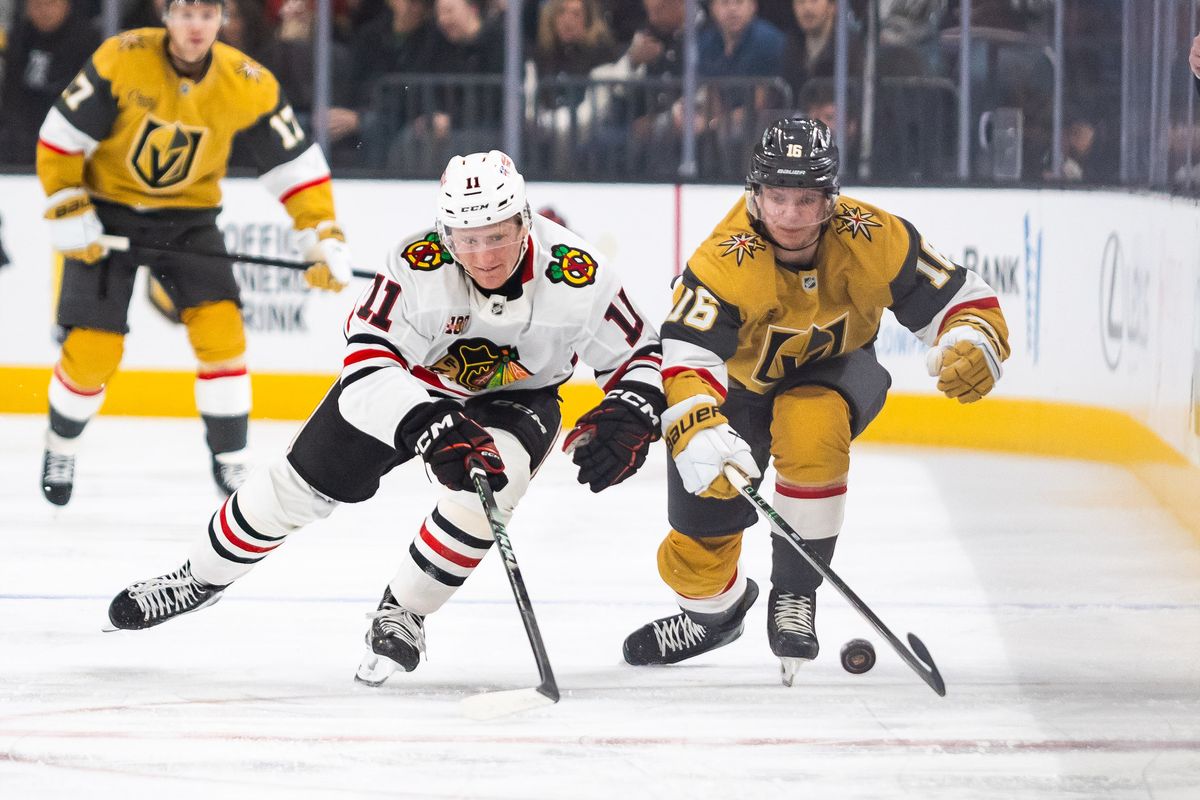 Chicago Blackhawks center Oliver Moore (11) and Vegas Golden Knights right wing Pavel Dorofeyev (16) both go after a loose puck during a NHL game between the Vegas Golden Knights and the Chicago Blackhawks, Tuesday December 2, 2025 in Las Vegas, Nev. Chicago Blackhawks center Oliver Moore (11) and Vegas Golden Knights right wing Pavel Dorofeyev (16) both go after a loose puck during a NHL game between the Vegas Golden Knights and the Chicago Blackhawks, Tuesday December 2, 2025 in Las Vegas, Nev.