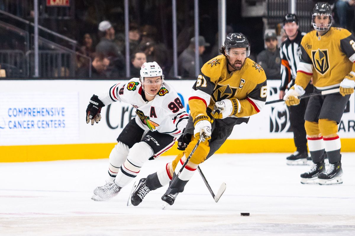 Vegas Golden Knights right-wing Mark Stone (61) skates with the puck as Chicago Blackhawks center Connor Bedard (98) trails behind him during a NHL game between the Vegas Golden Knights and the Chicago Blackhawks, Tuesday December 2, 2025 in Las Vegas, Nev. Vegas Golden Knights right-wing Mark Stone (61) skates with the puck as Chicago Blackhawks center Connor Bedard (98) trails behind him during a NHL game between the Vegas Golden Knights and the Chicago Blackhawks, Tuesday December 2, 2025 in Las Vegas, Nev.