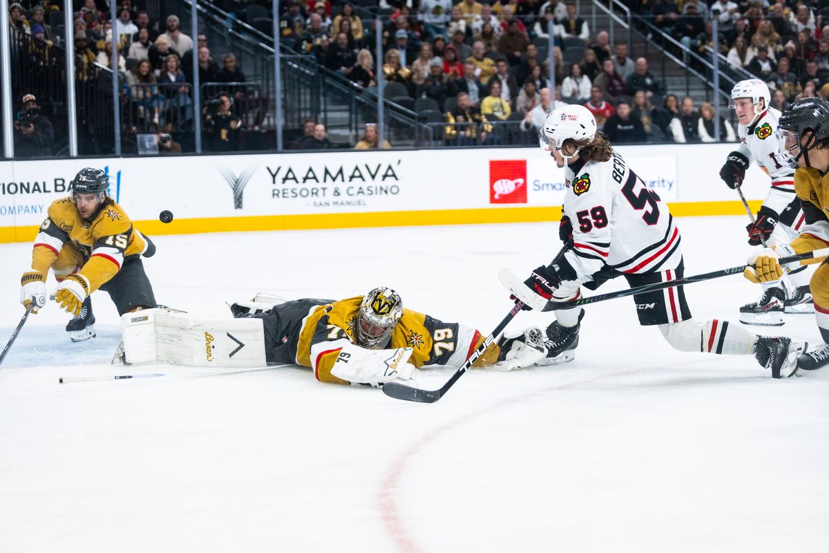 Chicago Blackhawks left-wing Tyler Bertuzzi (59) shoots the puck at the net as Vegas Golden Knights goaltender Carter Hart (79) dives on the ice during a NHL game between the Vegas Golden Knights and the Chicago Blackhawks, Tuesday December 2, 2025 in Las Vegas, Nev. Chicago Blackhawks left-wing Tyler Bertuzzi (59) shoots the puck at the net as Vegas Golden Knights goaltender Carter Hart (79) dives on the ice during a NHL game between the Vegas Golden Knights and the Chicago Blackhawks, Tuesday December 2, 2025 in Las Vegas, Nev.