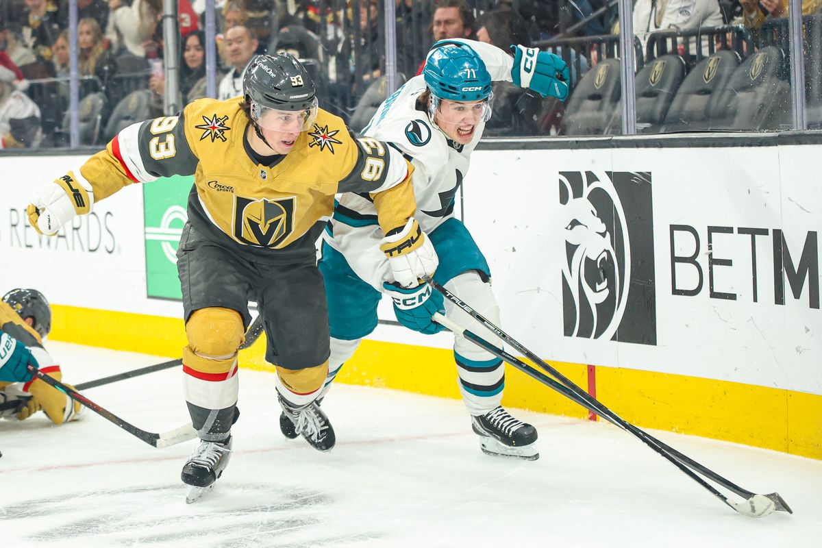 Vegas Golden Knights F Mitch Marner (93) and San Jose Sharks F Macklin Celebrini (71) fight for puck possession during an NHL game on Tuesday December 23, 2025, in Las Vegas, Nevada. Vegas Golden Knights F Mitch Marner (93) and San Jose Sharks F Macklin Celebrini (71) fight for puck possession during an NHL game on Tuesday December 23, 2025, in Las Vegas, Nevada.