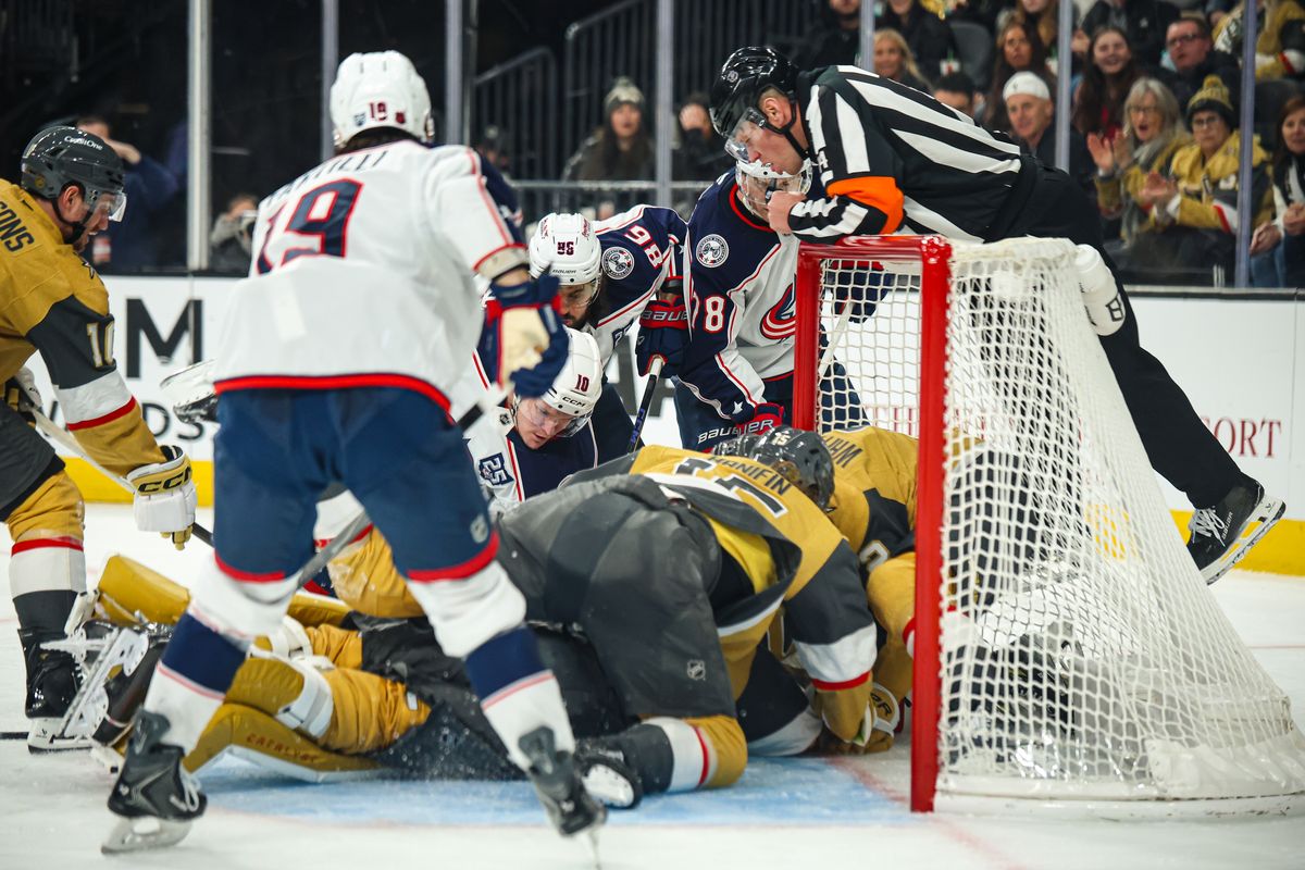 Multiple players for the Vegas Golden Knights and Columbus Blue Jackets battle for the puck in the crease on Thursday January 8, 2026, in Las Vegas, Nevada. Multiple players for the Vegas Golden Knights and Columbus Blue Jackets battle for the puck in the crease on Thursday January 8, 2026, in Las Vegas, Nevada.
