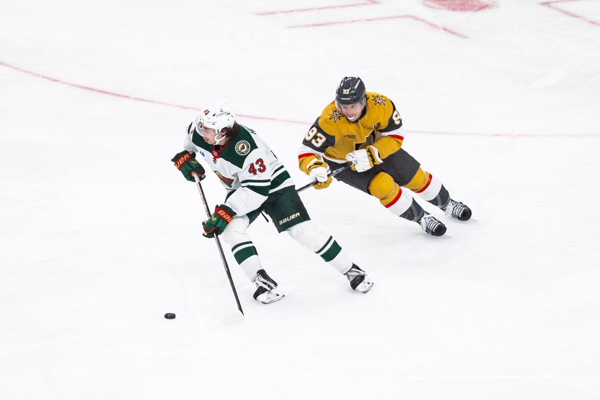 Minnesota Wild defenseman Quinn Hughes (43) skates with the puck as Vegas Golden Knights right-wing Mitch Marner (93) follows him during a NHL game between the Vegas Golden Knights and the Minnesota Wild, Friday March 6, 2026 in Las Vegas, Nev. Minnesota Wild defenseman Quinn Hughes (43) skates with the puck as Vegas Golden Knights right-wing Mitch Marner (93) follows him during a NHL game between the Vegas Golden Knights and the Minnesota Wild, Friday March 6, 2026 in Las Vegas, Nev.
