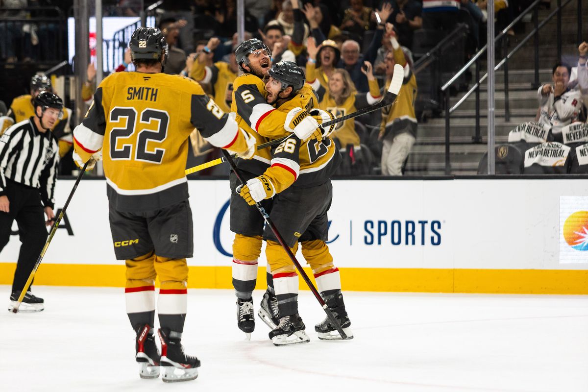 Vegas Golden Knights defenseman Jeremy Lauzon (5) embraces center Nic Dowd (26) after Dowd scores a goal during a NHL game between the Vegas Golden Knights and the Washington Capitals, Saturday March 28, 2026 in Las Vegas, Nev. Vegas Golden Knights defenseman Jeremy Lauzon (5) embraces center Nic Dowd (26) after Dowd scores a goal during a NHL game between the Vegas Golden Knights and the Washington Capitals, Saturday March 28, 2026 in Las Vegas, Nev.