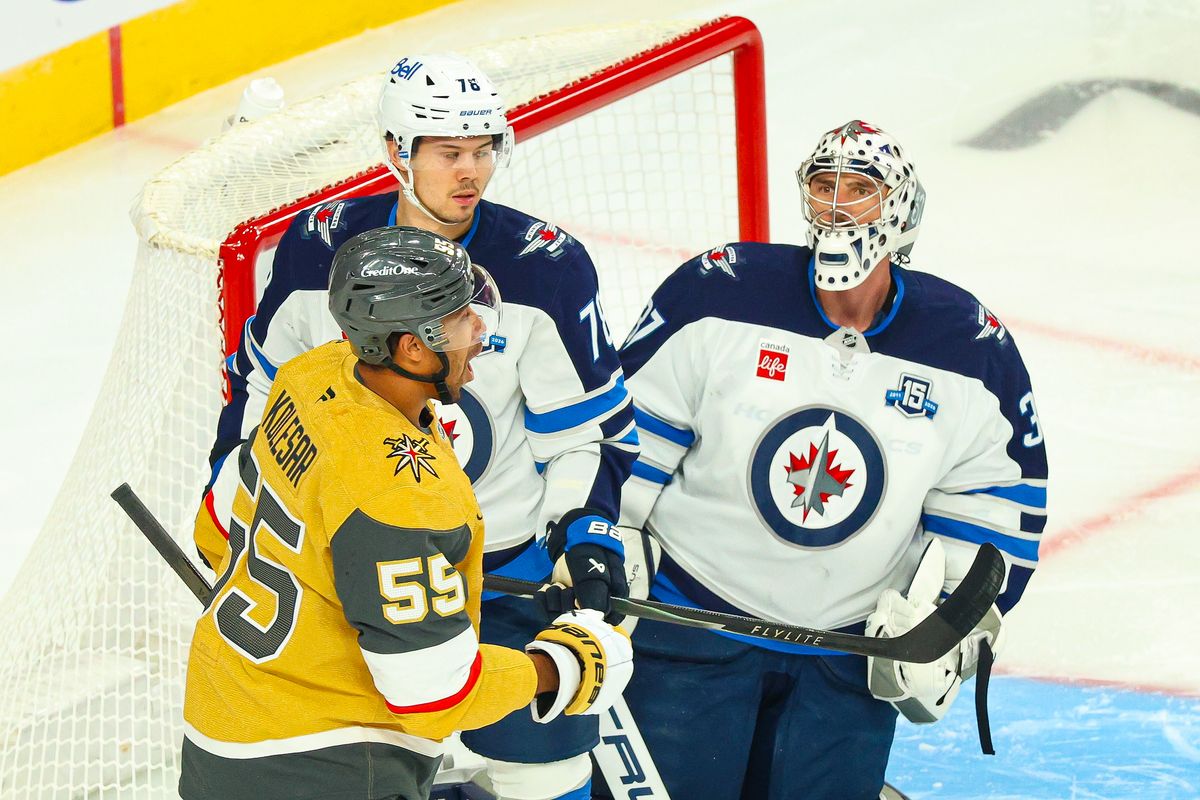 Winnipeg Jets G Connor Hellebuyck (37) stares down Vegas Golden Knights F Keegan Kolesar (55) after making a save during an NHL game on Monday, April 13, 2026, in Las Vegas, Nevada. Winnipeg Jets G Connor Hellebuyck (37) stares down Vegas Golden Knights F Keegan Kolesar (55) after making a save during an NHL game on Monday, April 13, 2026, in Las Vegas, Nevada.