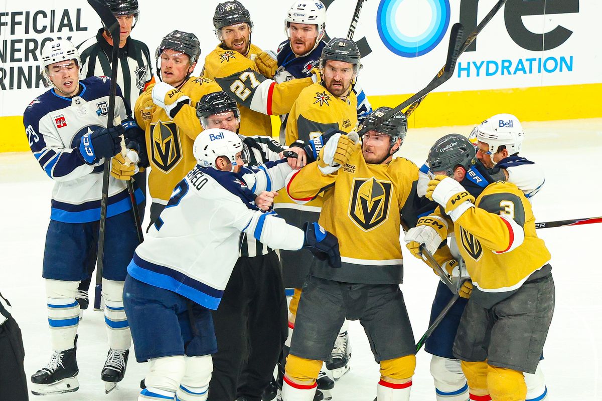 Vegas Golden Knights F Ivan Barbashev (49) and Winnipeg Jets F Nikita Chibrikov (90) each receive roughing penalties after a scrum in the second period of an NHL game on Monday, April 13, 2026, in Las Vegas, Nevada. Vegas Golden Knights F Ivan Barbashev (49) and Winnipeg Jets F Nikita Chibrikov (90) each receive roughing penalties after a scrum in the second period of an NHL game on Monday, April 13, 2026, in Las Vegas, Nevada.