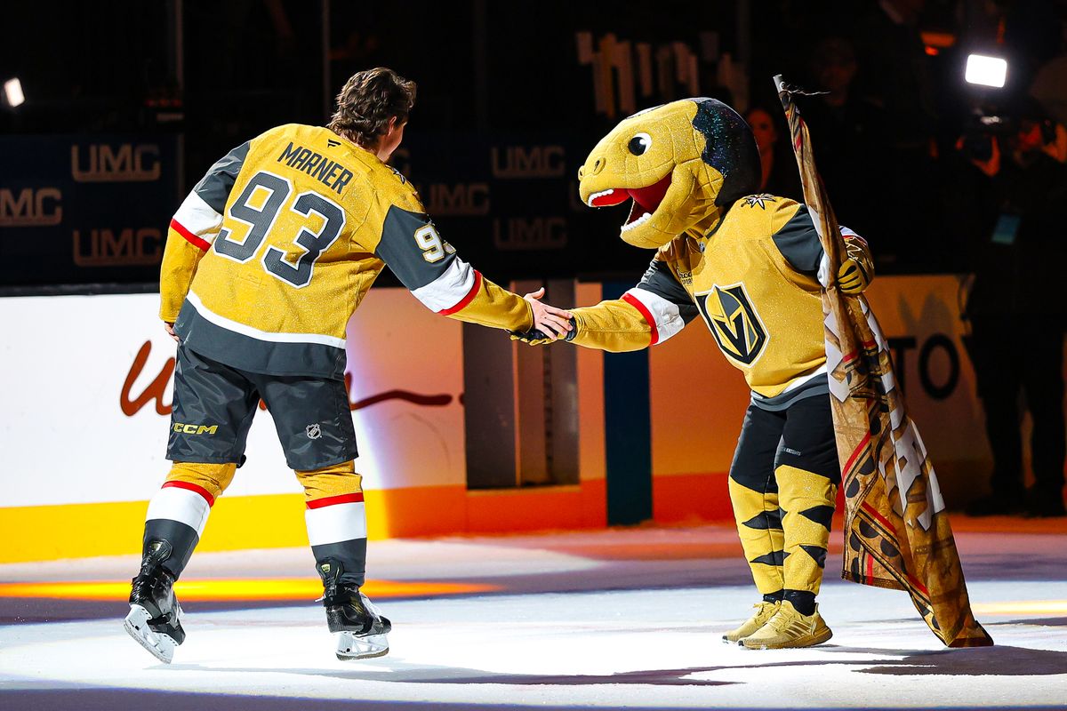 Vegas Golden Knights F Mitch Marner (93) high-fives the Vegas Golden Knights mascot Chance during the three-star ceremony after an NHL game against the Seattle Kraken on Wednesday, April 15, 2026, in Las Vegas, Nevada. Vegas Golden Knights F Mitch Marner (93) high-fives the Vegas Golden Knights mascot Chance during the three-star ceremony after an NHL game against the Seattle Kraken on Wednesday, April 15, 2026, in Las Vegas, Nevada.