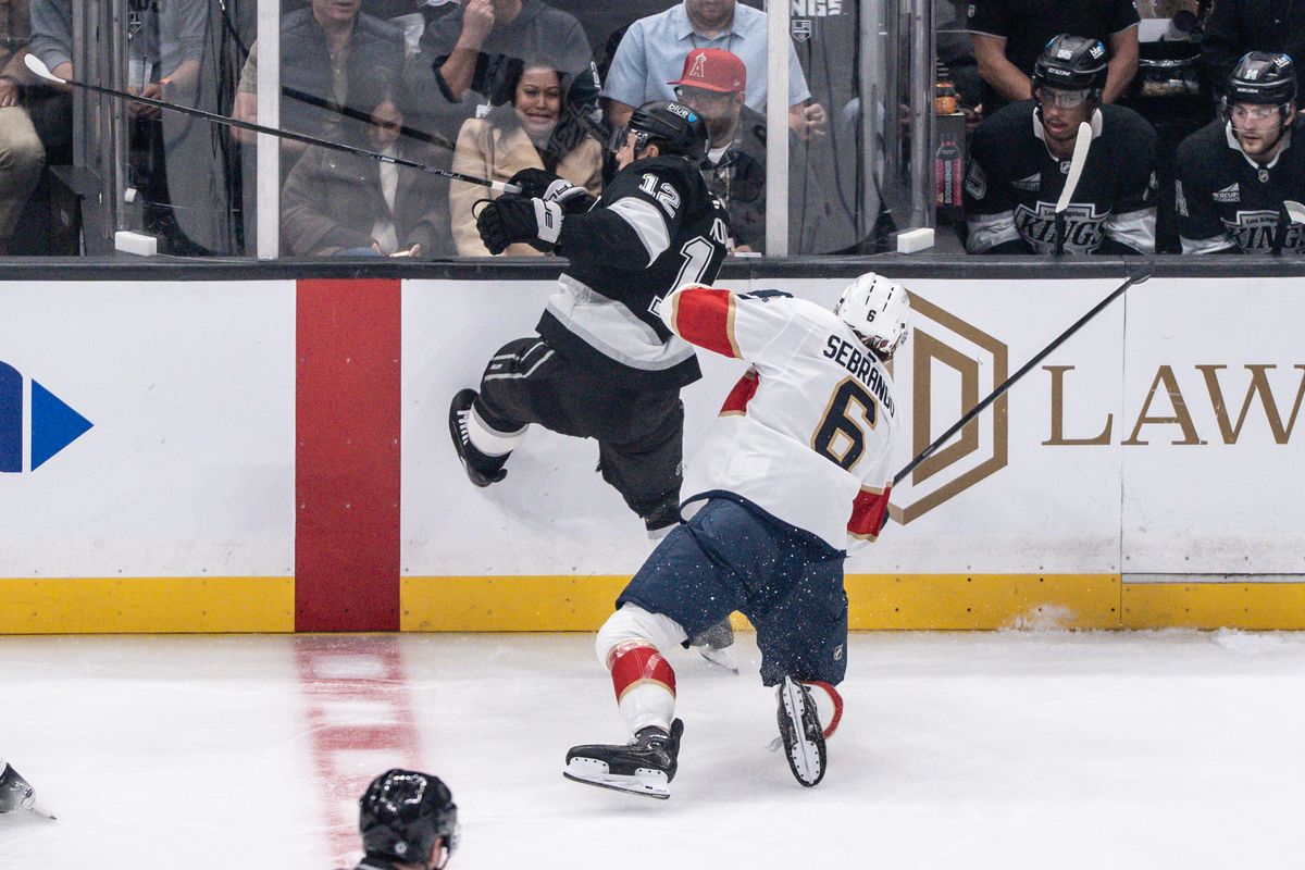 Los Angeles Kings Left Wing Trevor Moore (12) gets shoved in the back into the glass during an NHL hockey game against the Florida Panthers, Thursday November 6, 2025 in Los Angeles. Los Angeles Kings Left Wing Trevor Moore (12) gets shoved in the back into the glass during an NHL hockey game against the Florida Panthers, Thursday November 6, 2025 in Los Angeles.
