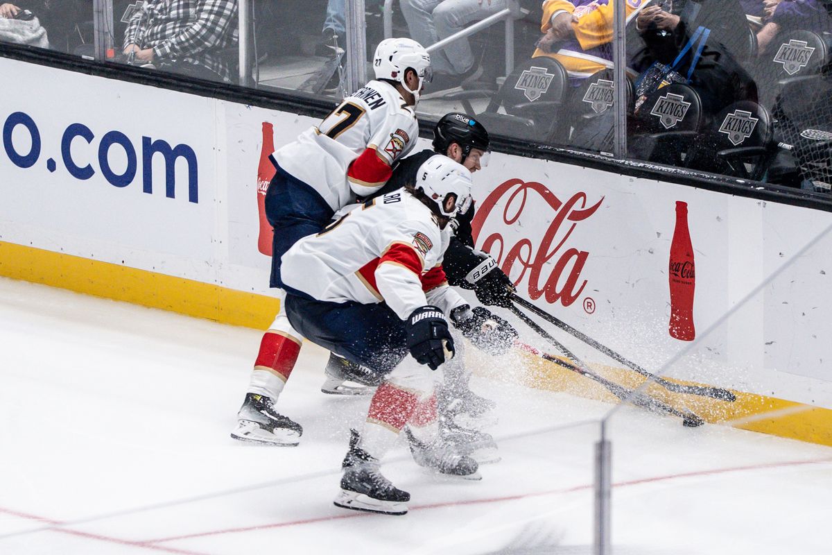 Los Angeles Kings player takes on two defenders while trying to get the puck during an NHL hockey game against the Florida Panthers, Thursday November 6, 2025 in Los Angeles. Los Angeles Kings player takes on two defenders while trying to get the puck during an NHL hockey game against the Florida Panthers, Thursday November 6, 2025 in Los Angeles.