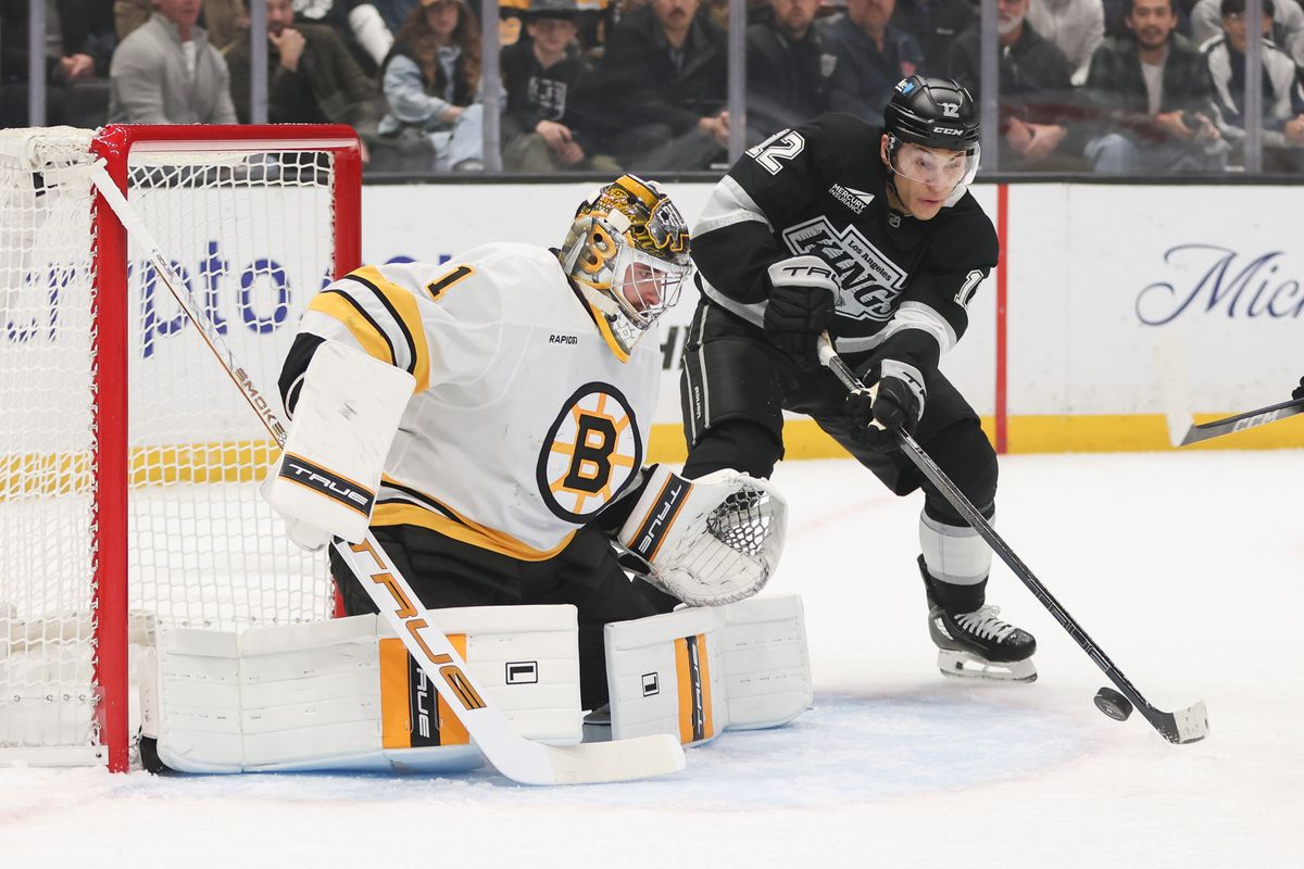 Left wing Trevor Moore #12 of the Los Angeles Kings attempts to get the puck on goal against goaltender Jeremy Swagman #1 of the Boston Bruins during an NHL hockey game, Friday November 21, 2025 in Los Angeles, Calif. Left wing Trevor Moore #12 of the Los Angeles Kings attempts to get the puck on goal against goaltender Jeremy Swagman #1 of the Boston Bruins during an NHL hockey game, Friday November 21, 2025 in Los Angeles, Calif.