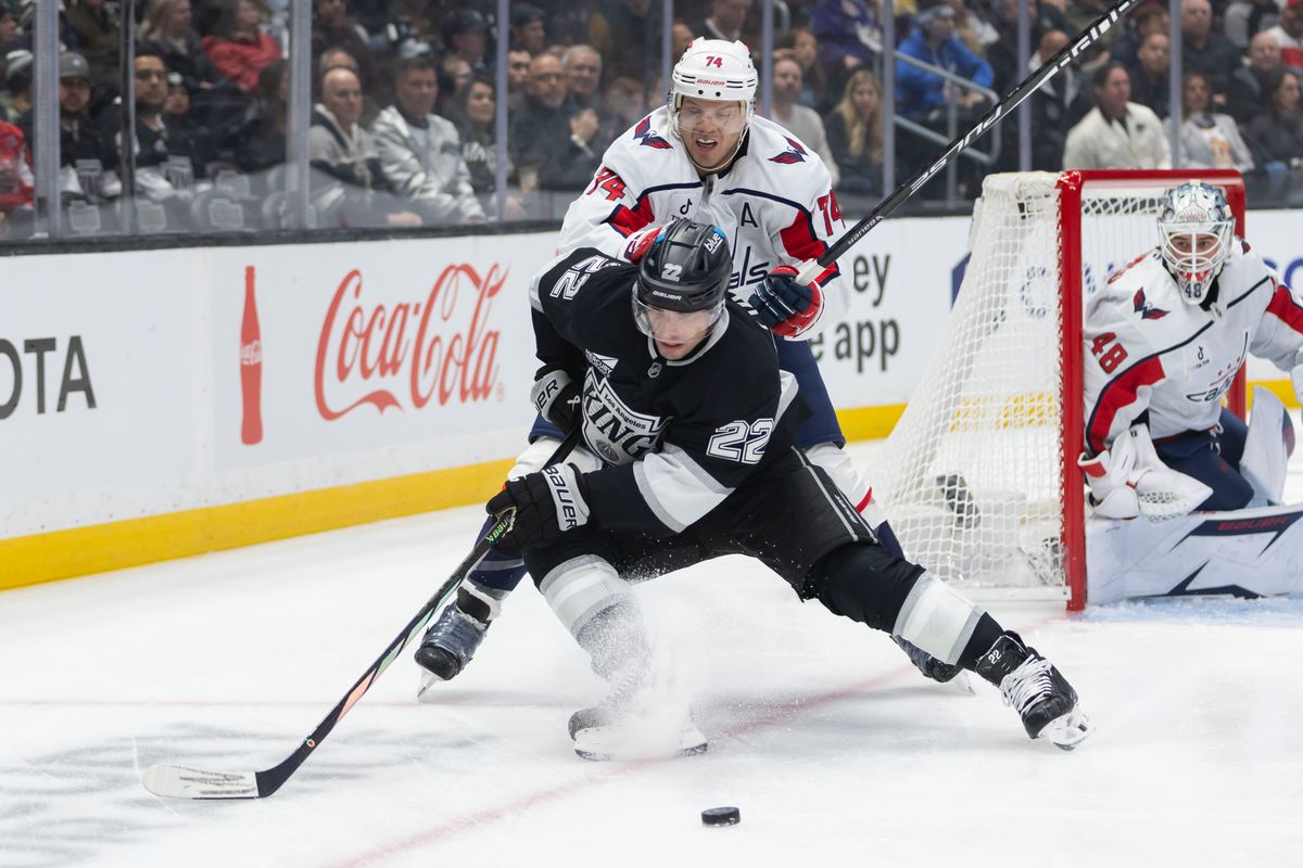 Left wing Kevin Fiala #22 of the Los Angeles Kings reaches for the puck as defenseman John Carlson #74 of the Washington Capitals pushes him during an NHL hockey game, Tuesday December 2, 2025 in Los Angeles, Calif. Left wing Kevin Fiala #22 of the Los Angeles Kings reaches for the puck as defenseman John Carlson #74 of the Washington Capitals pushes him during an NHL hockey game, Tuesday December 2, 2025 in Los Angeles, Calif.