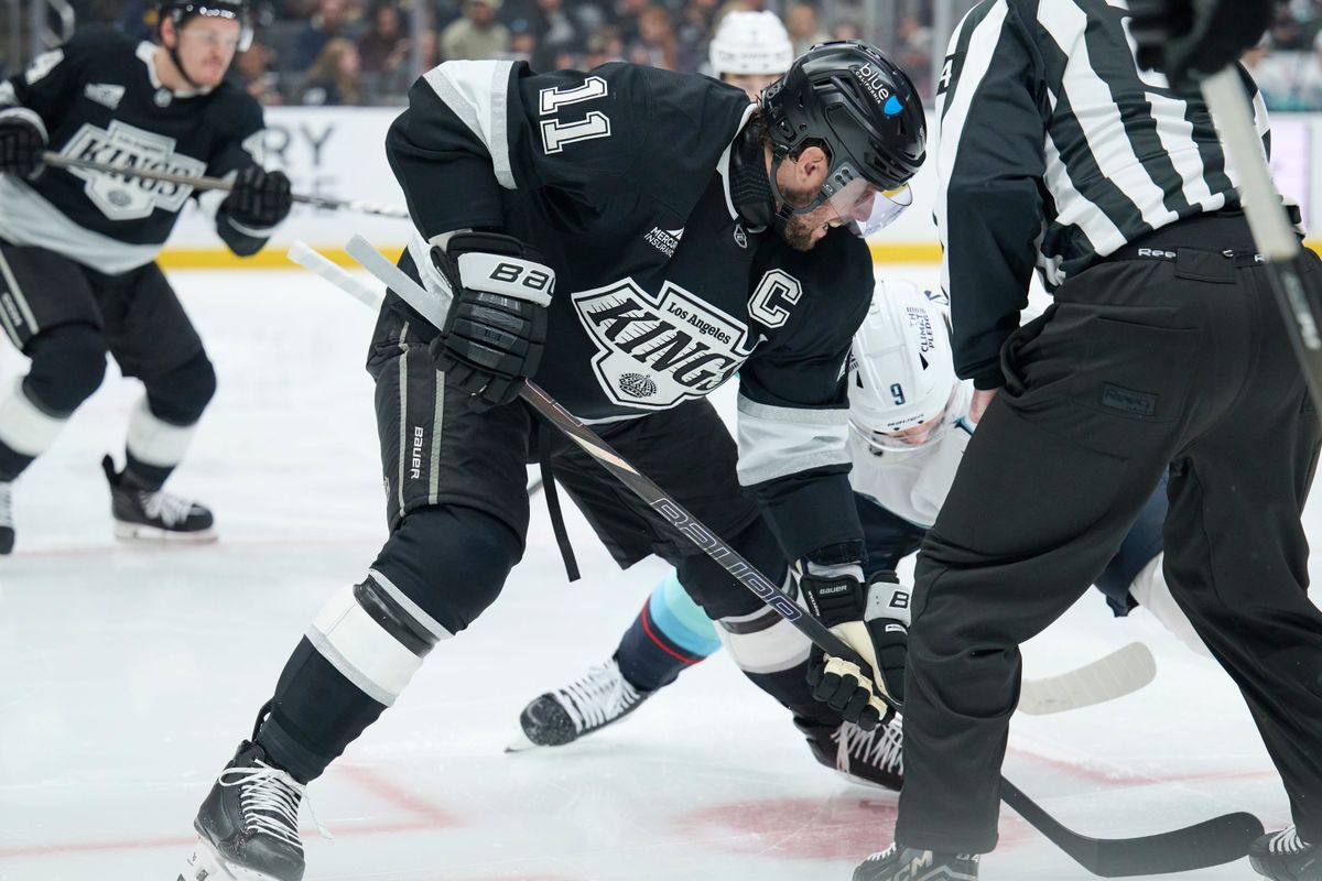 Los Angeles Kings center Anze Kopitar (11) fights for the puck against the Kraken at the crypto.com Arena on December 23,2025 in Los Angeles, California. Los Angeles Kings center Anze Kopitar (11) fights for the puck against the Kraken at the crypto.com Arena on December 23,2025 in Los Angeles, California.