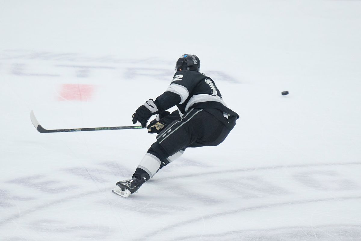 Los Angeles Kings left wing Trevor Moore (12) cuts for the puck against the Kraken at the crypto.com Arena on December 23,2025 in Los Angeles, California. Los Angeles Kings left wing Trevor Moore (12) cuts for the puck against the Kraken at the crypto.com Arena on December 23,2025 in Los Angeles, California.