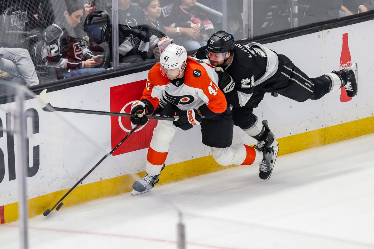Scott Laughton #21 of the Los Angeles Kings reaches for the puck overNoah Juulsen #47 of the Philadelphia Flyers during an NHL hockey game, Thursday March 19, 2026 in Los Angeles, Calif. Scott Laughton #21 of the Los Angeles Kings reaches for the puck overNoah Juulsen #47 of the Philadelphia Flyers during an NHL hockey game, Thursday March 19, 2026 in Los Angeles, Calif.