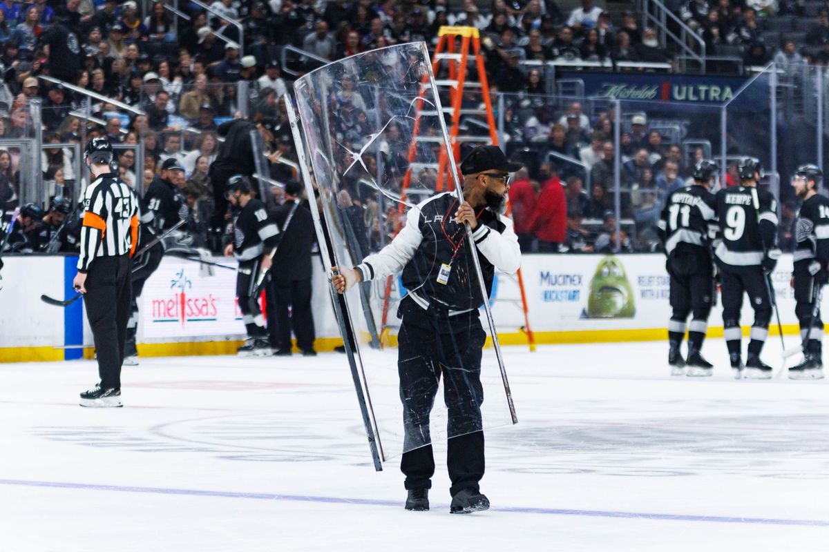 Los Angeles Kings maintenance crew members switches out a glass panel during an NHL match against the Utah Mammoth on March 28, 2026 in Los Angeles, California. Los Angeles Kings maintenance crew members switches out a glass panel during an NHL match against the Utah Mammoth on March 28, 2026 in Los Angeles, California.